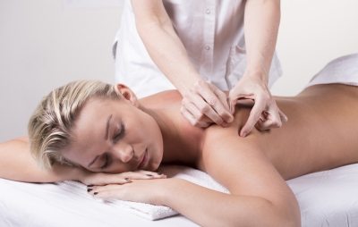 Chiropractor dry needling a relaxed woman