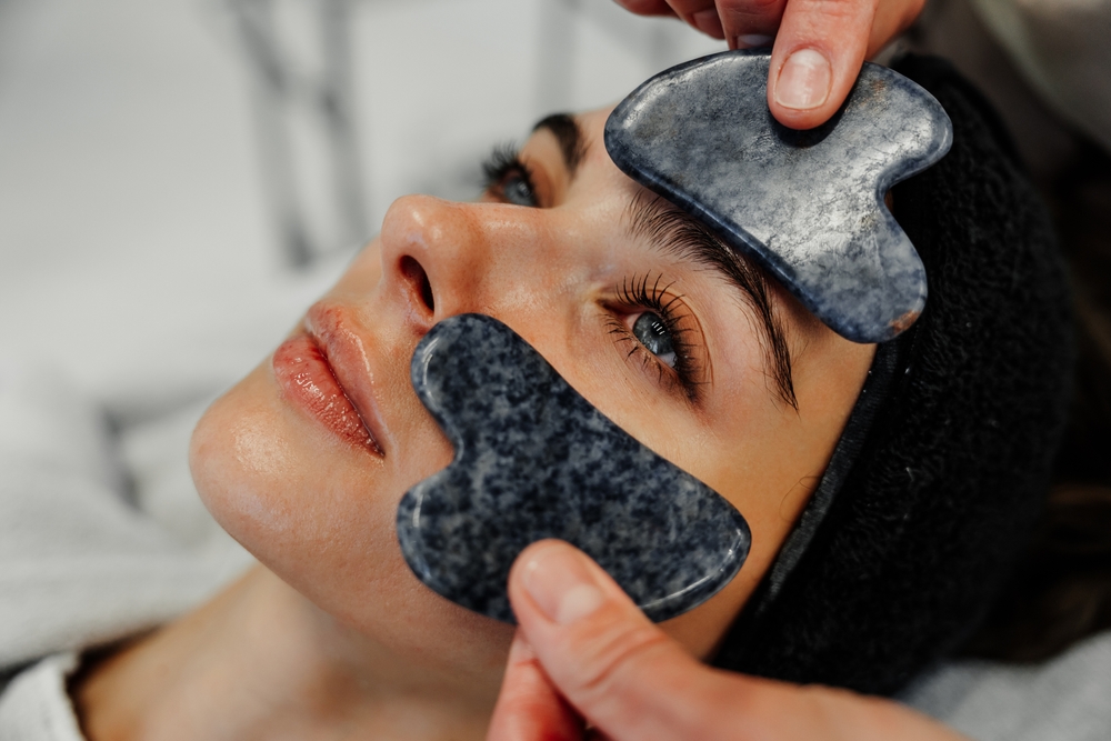 Relaxing,Facial,Treatment,With,Gua,Sha,Stones,At,A,Spa